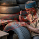Counterfeit tires on a car causing safety hazards and increased risks